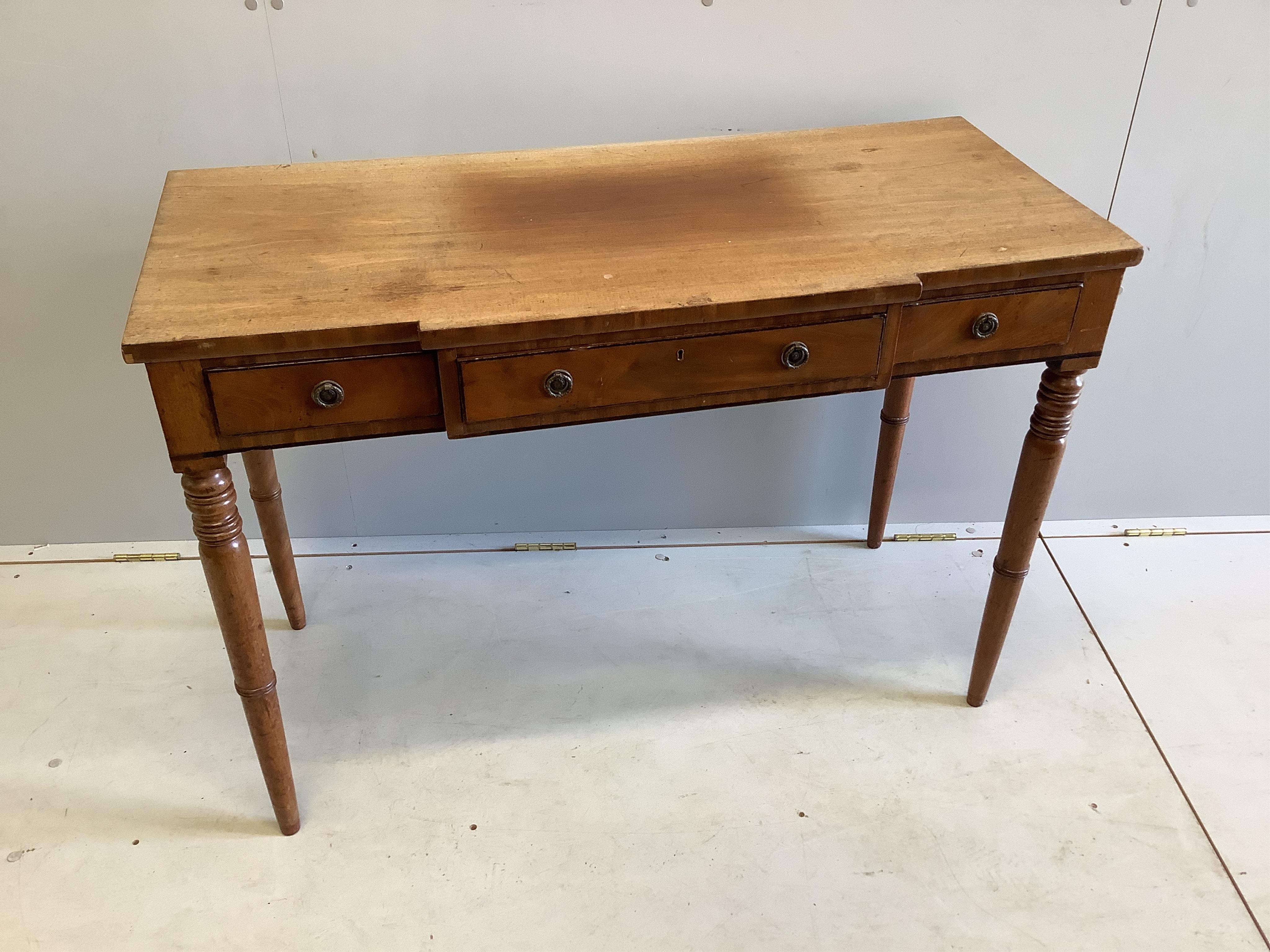 A Regency mahogany breakfront kneehole dressing table, width 106cm, depth 47cm, height 73cm